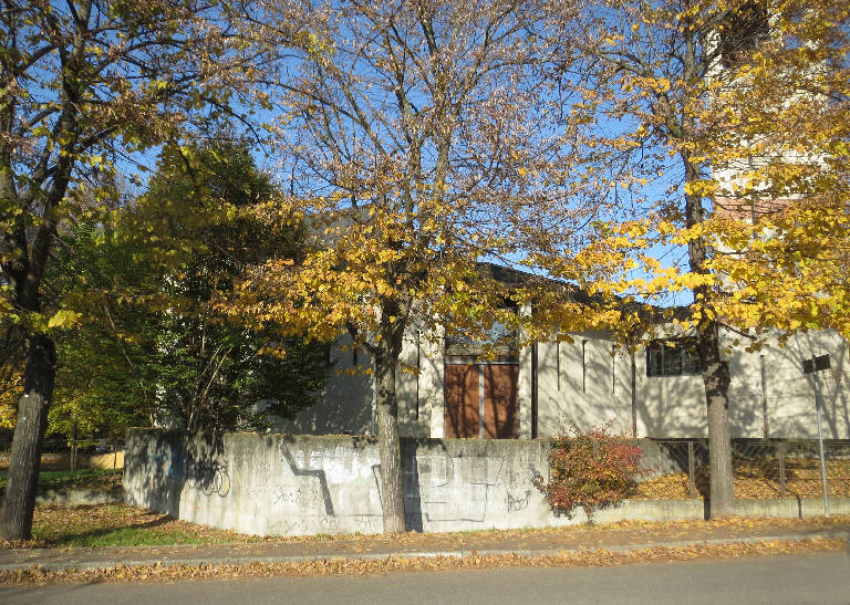 Primary subject is CAPPELLA DEL SACRO CUORE in Pavia. The surrounding environment shows the urban or architectural context of the building, with the work presented as the main focus.